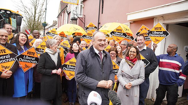 Liberal Democrats - For a Fair Deal Ed Davey in front of crowd with Lib Dem diamond signs