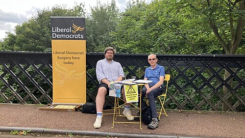 James and Peter sitting at pop-up surgery on Armstrong Bridge