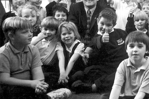 Ed Davey with a group of school kids.