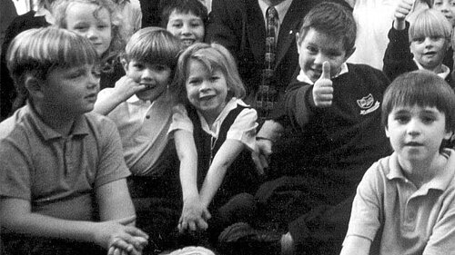 Ed Davey with a group of school kids.